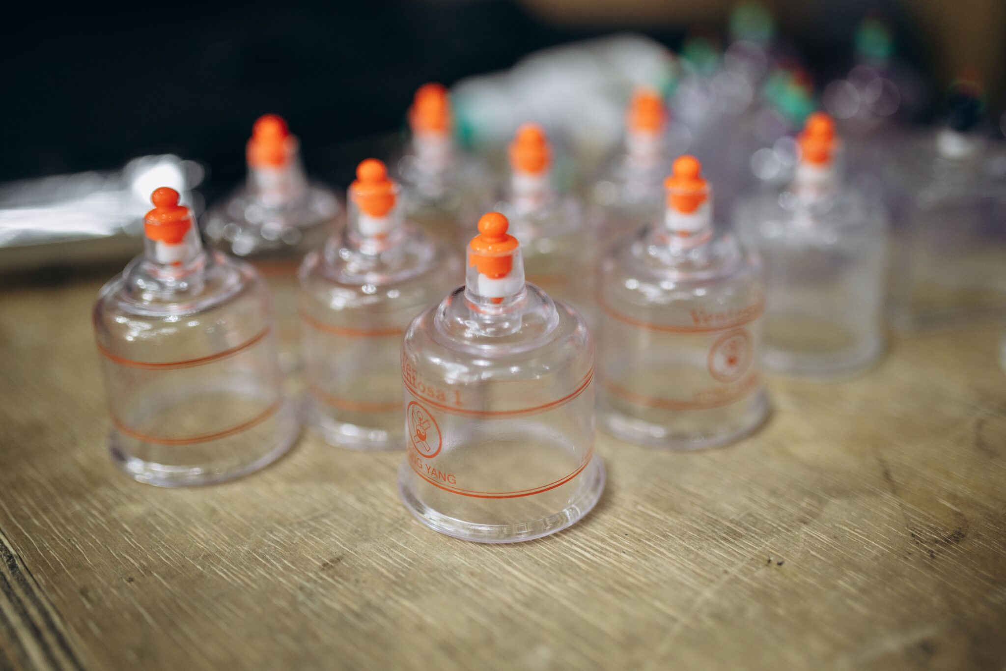 Close-up view of multiple cupping therapy cups used for massage and muscle recovery.